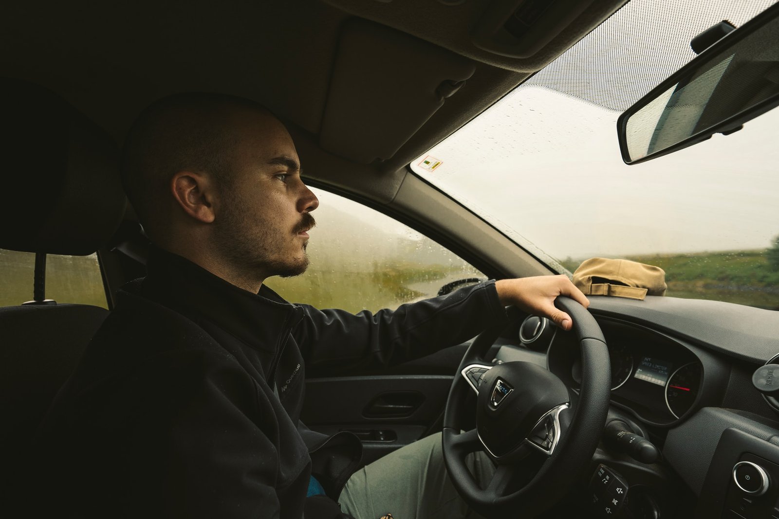 man in car driving